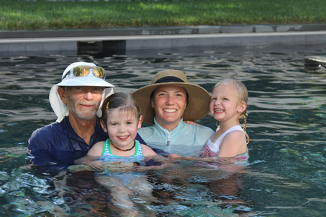 Mrs. Karen and Mr. Ed swim instructors with children in pool